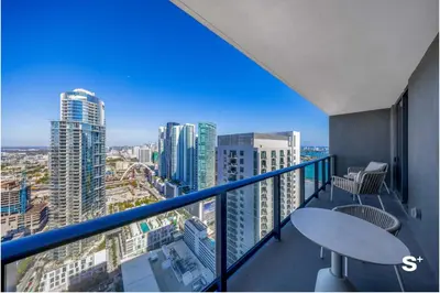 a balcony with a view of a city at Contemporary 2-BD Condo in Downtown Miami - Skyline & Ocean Views in Miami