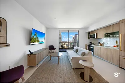 a living room with a couch and a table at Contemporary 2-BD Condo in Downtown Miami - Skyline & Ocean Views in Miami