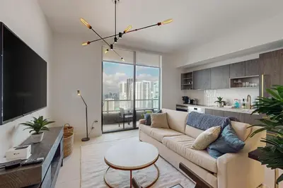 a living room with a couch and a table at Beachside Bliss Estate 4801 in Miami