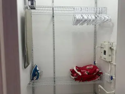 a bathroom with a shelf with a red bag on it at Villa Clara Red-Little Havana in Miami