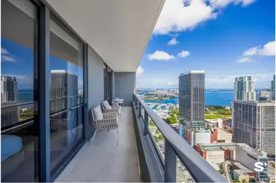 a balcony with views of the city and the ocean at Downtown 1-BD Condo with City Views in Miami