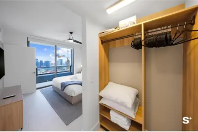 a bedroom with a bunk bed and a window at Downtown 1-BD Condo with City Views in Miami
