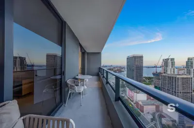 a balcony with a view of a city skyline at Downtown 1-BD Condo with City Views in Miami