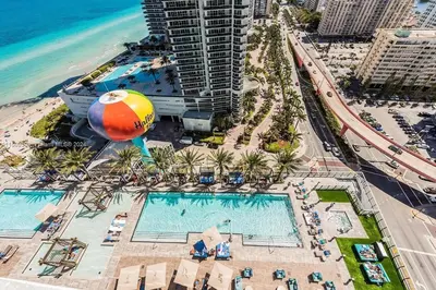 an overhead view of a pool at a resort at Beautiful Hyde Resort Luxe 2BR Private Beachfront in Hollywood
