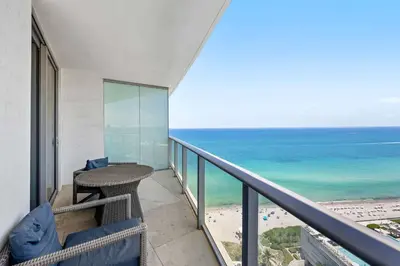 a balcony with a view of the ocean at Beautiful Hyde Resort Luxe 2BR Private Beachfront in Hollywood