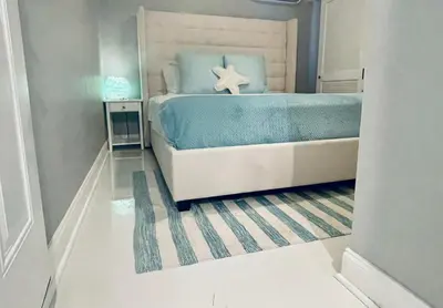 a bedroom with a bed with a starfish on it at Best Location!! in Miami