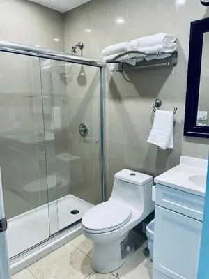 a bathroom with a shower and a toilet and a sink at Best Location!! in Miami