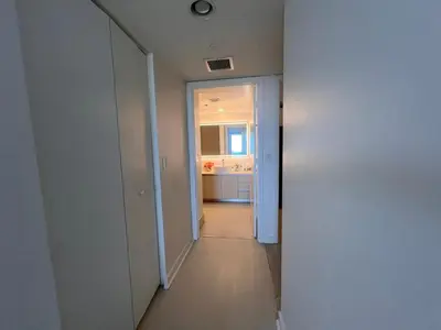 a hallway leading to a kitchen in a apartment at Luxury Ocean Views Apt in Hallandale Beach in Hallandale Beach