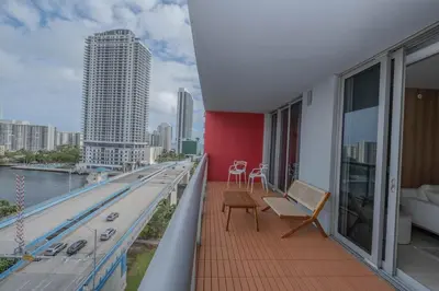 a balcony of a building with a view of a city at 2B 2B Luxury Ocean Views Apt in Hallandale Beach in Hallandale Beach