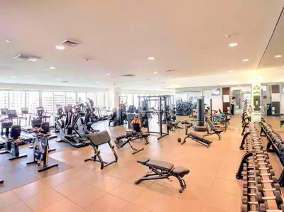 a gym with a lot of treadms and pilates equipment at High Ceiling Exquisite 1BR 1BA ICON Brickell in Miami