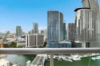 a view of a city with tall buildings and a river at High Ceiling Exquisite 1BR 1BA ICON Brickell in Miami