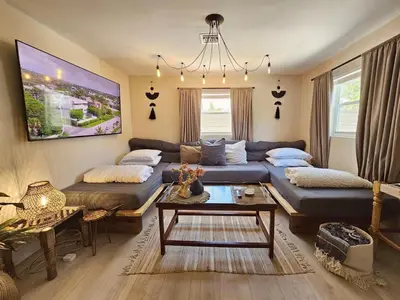 a living room with a couch and a table at Casa Eden - Half mile to Lauderdale Marine Center - 4 bedrooms - 2 bathrooms in Fort Lauderdale