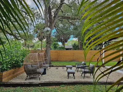 a group of chairs and tables in a park at -Disco Bungalow- One third mile to FTL Marine Center in Fort Lauderdale