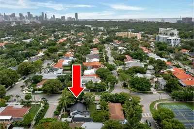 an aerial view of a city with a red arrow at Casa Del Sol Cozy 2br Retreat 10 Mins To Beach in Miami