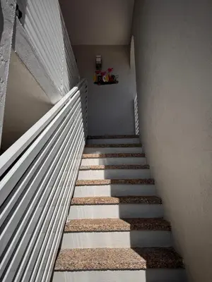 a staircase in a house with white stair treads at Stylish 2 Bedrooms Apartment by Miami Airport in Miami
