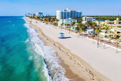 an aerial view of a beach with buildings and the ocean at Beach Breeze Suite - Steps to the Beach in Hollywood