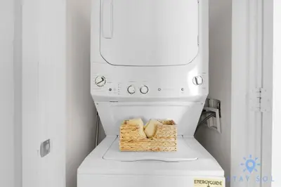 a white washing machine with bread on top of it at 2 BR Apartment with Amenities and Balcony in Hollywood