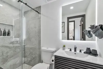 a bathroom with a shower and a toilet and a sink at Casa Belle 3br W Pool & Bbq 10 Mins To Beach in Miami