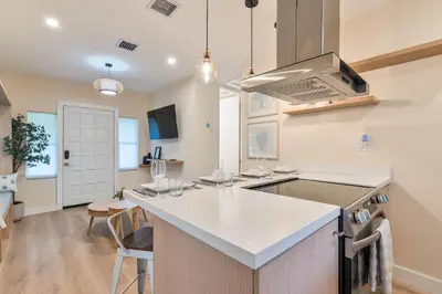 a kitchen with a sink and a counter top at Casa Bellini Modern 3br W Bbq -10 Mins To Beac in Miami