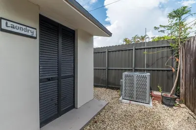 a house with a black door and a fence at Casa Bellini Modern 3br W Bbq -10 Mins To Beac in Miami