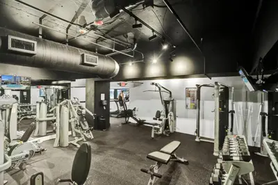 a gym with several treadmills and cardio machines at Lovely 2BR condo with Resort Access, Gym and Pool 1608 in Miami Beach