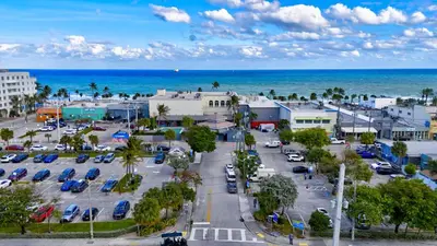an aerial view of a parking lot next to the ocean at Banyan St. 1BR 1BA off Las Olas - Steps to Beach in Fort Lauderdale