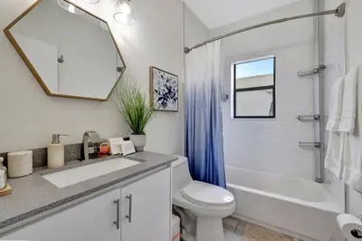 a bathroom with a sink and a toilet and a shower at 3BR 2.5BA Townhome-10 mins to FTL Beach and Downtown in Fort Lauderdale