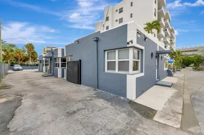 a blue and white building on a street at Banyan St 2BR 1BA off Las Olas- Steps to Beach unit 4 in Fort Lauderdale