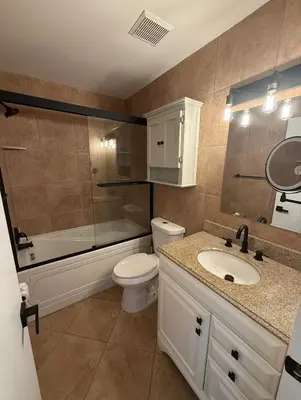 a bathroom with a toilet and a shower and a sink at 1644 Jackson St, Hollywood, FL 33020 in Hollywood