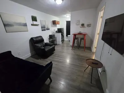 a living room with a couch and a table at Cozy Place Near Design District - 3 in Miami