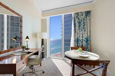 a room with a desk and a large window at Unique Apartment Miami Views in Sunny Isles Beach