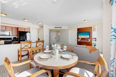 a dining room and living room with a table and chairs at Unique Apartment Miami Views in Sunny Isles Beach
