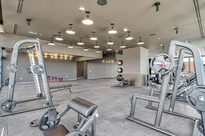 a gym with several exercise equipment in a room at 1 BR - City Views Gym & Pool in Miami