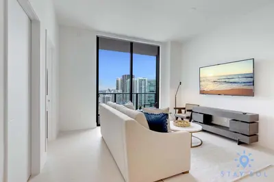 a living room with a couch and a table at Best Stay - City Views Gym & Pool in Miami