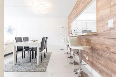 a kitchen and dining room with a table and chairs at Ocean Reserve in South Island