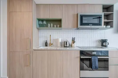 a kitchen with a counter top with a microwave at Lemon Drop - Modern Central & Full Amenities in Miami