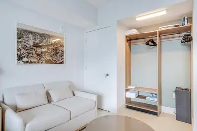 a living room with a white couch and a table at Lemon Drop - Modern Central & Full Amenities in Miami