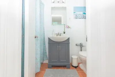 a bathroom with a sink and a toilet at Ocean Villa in Miami Beach