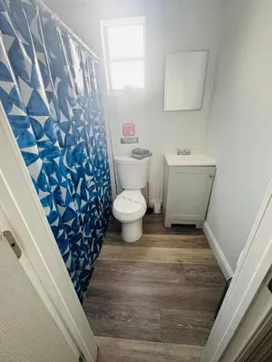 a bathroom with a toilet and a sink at Cozy place Near Design District - 1 in Miami