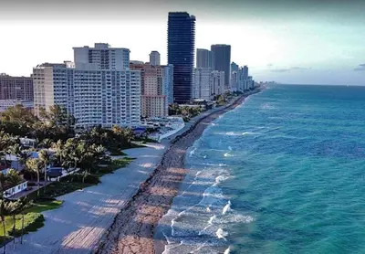 an aerial view of a beach with buildings and the ocean at Luxury Apt with Ocean View in Hallandale in Hallandale Beach