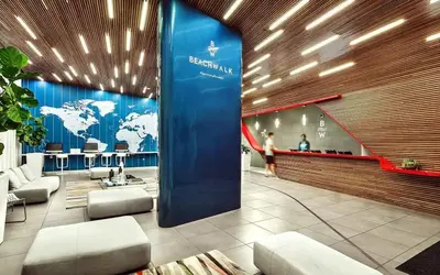 a lobby with a world map on the wall at Luxury Apt with Ocean View in Hallandale in Hallandale Beach