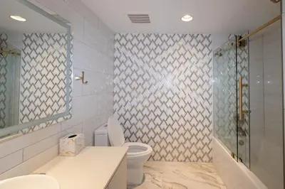 a bathroom with a toilet and a shower at The Royal Suite of Beachwalk 2b 2b Apmt in Hallandale Beach