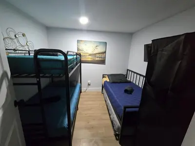a room with two bunk beds and a bed at Miami Urban Oasis - B in Miami