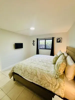 a bedroom with a large bed and a window at Apartment in Hollywood close to shops & beach 108 in Hollywood