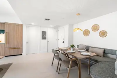 a living room with a table and a couch at New 26th floor amazing view 2BR-2BA in Miami