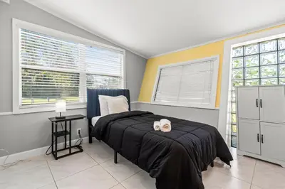 a bedroom with a bed with two towels on it at Fort Lauderdale Retreat Near Beach & Airport in Fort Lauderdale