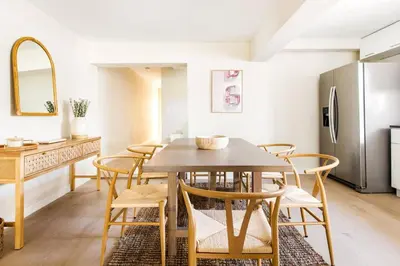 a kitchen and dining room with a table and chairs at Lux 6BR Villa with Pool, King Beds and Top Amenities in Miami