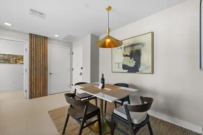 a dining room with a table and chairs at On The 49th Floor! Condo on Highest & Free Parking in Miami
