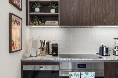 a kitchen with a stove and a counter top at On The 49th Floor! Condo on Highest & Free Parking in Miami