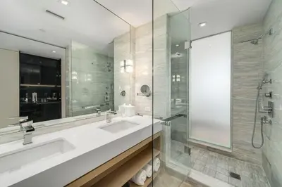 a bathroom with a large sink and a shower at SOUTH BEACH Stunning Studio in Miami Beach